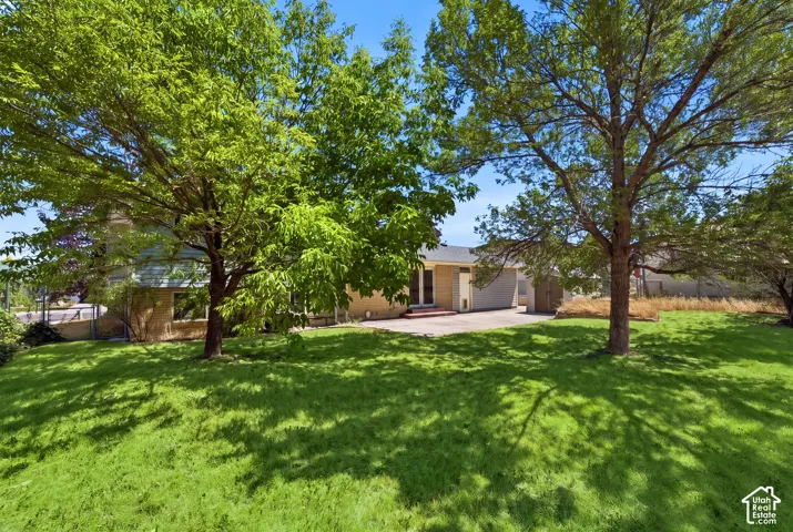 Grass has been virtually enhanced in this image to illustrate the property's outdoor potential.