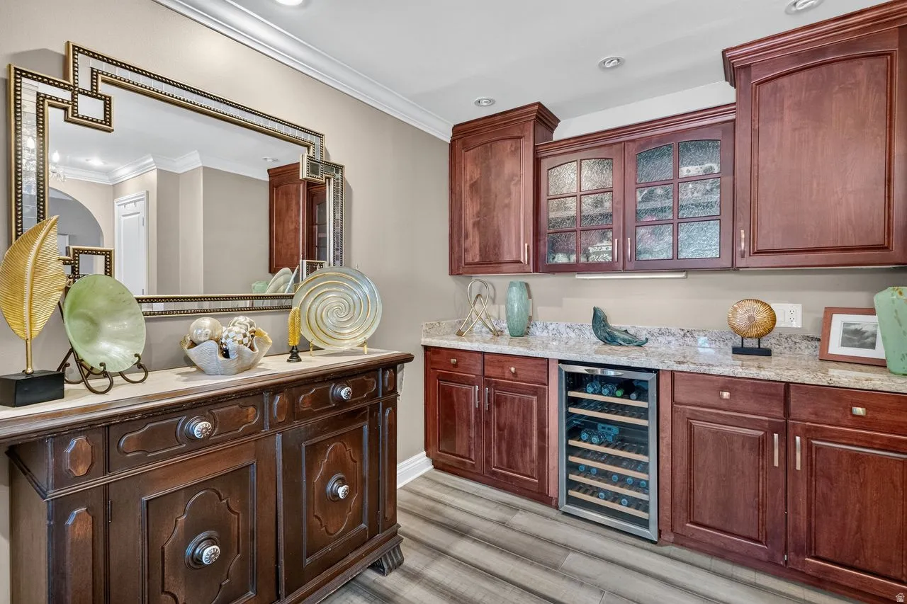 Custom cabinetry with glass-front uppers and under-cabinet lighting