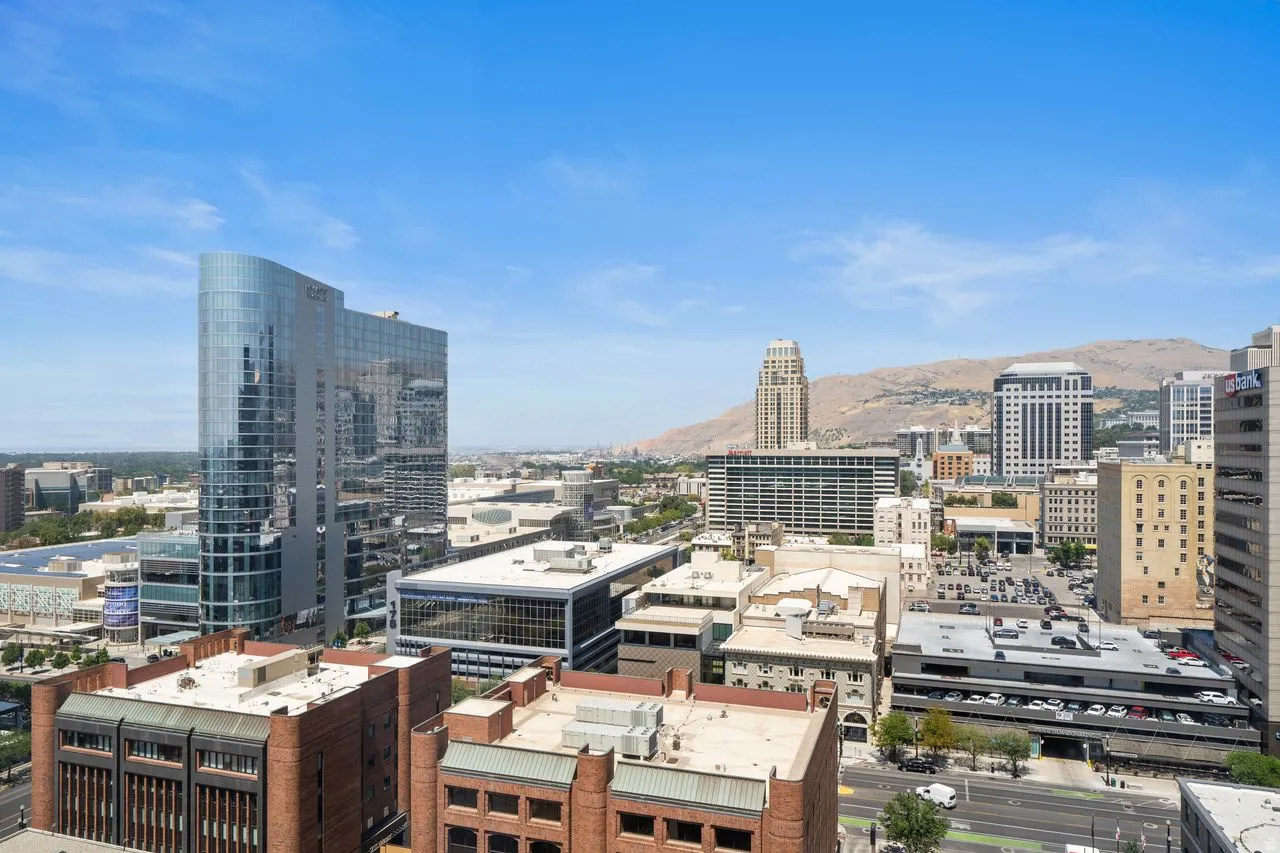 Expansive cityscape panorama featuring a variety of architectural styles under a clear sky