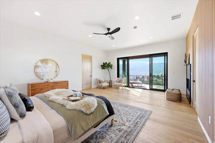 Bright interior featuring large sliding glass doors opening to an exterior balcony
