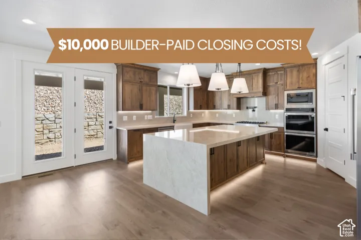 Kitchen featuring wood cabinetry, quartz waterfall island, recessed lighting with trio pendant fixtures, built-in double oven, and wood-finish flooring