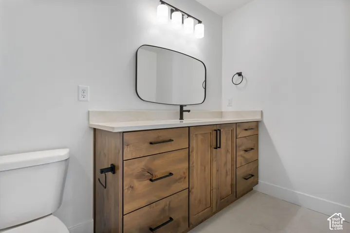 Expansive wood-finish vanity with multiple drawers and cabinet storage