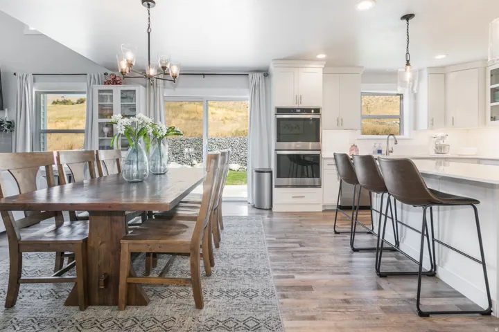 Open-concept kitchen and dining area with wood-finish flooring