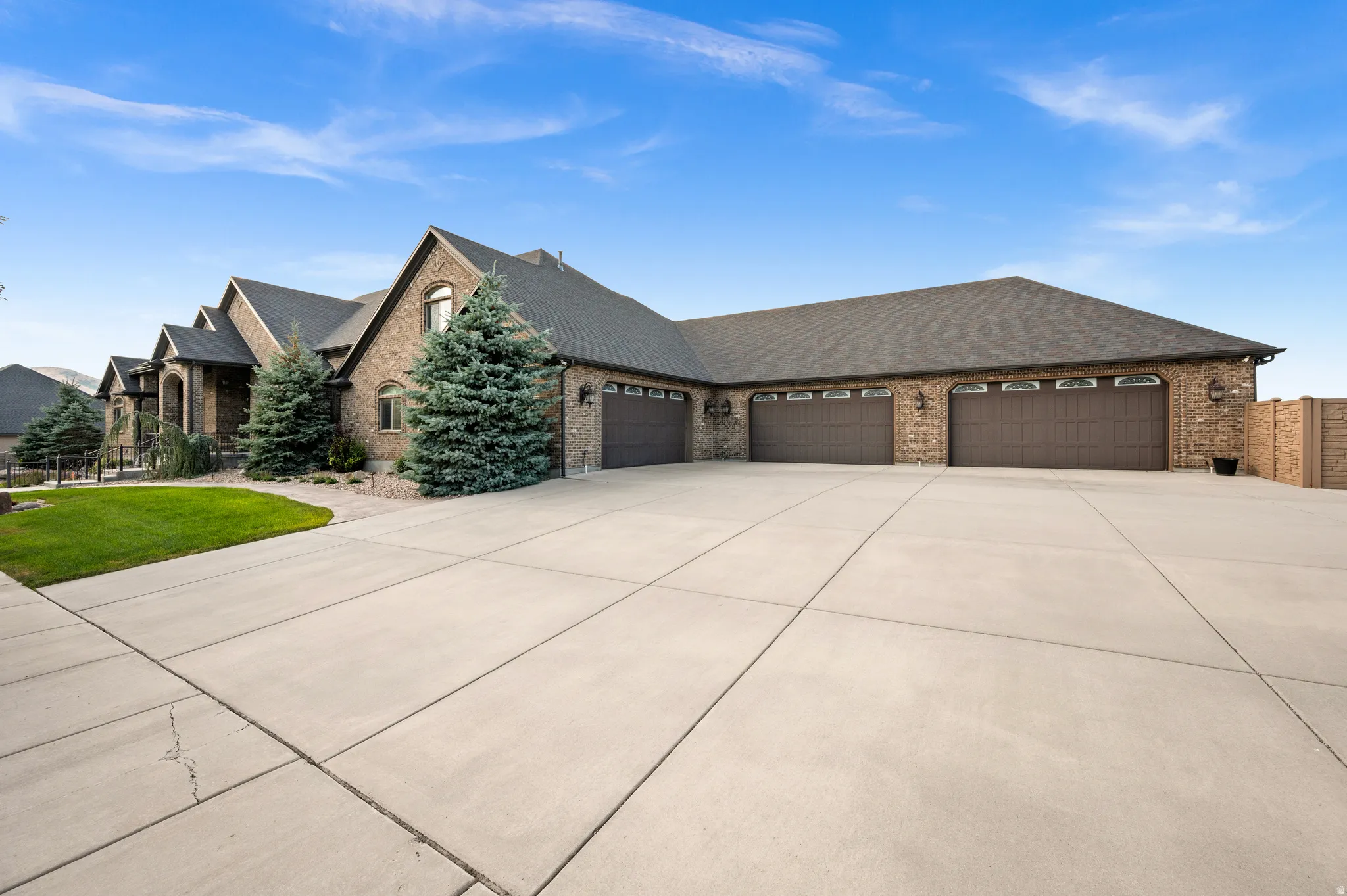 A grand entrance showcasing one of the estate's most exceptional features—a six-car garage.