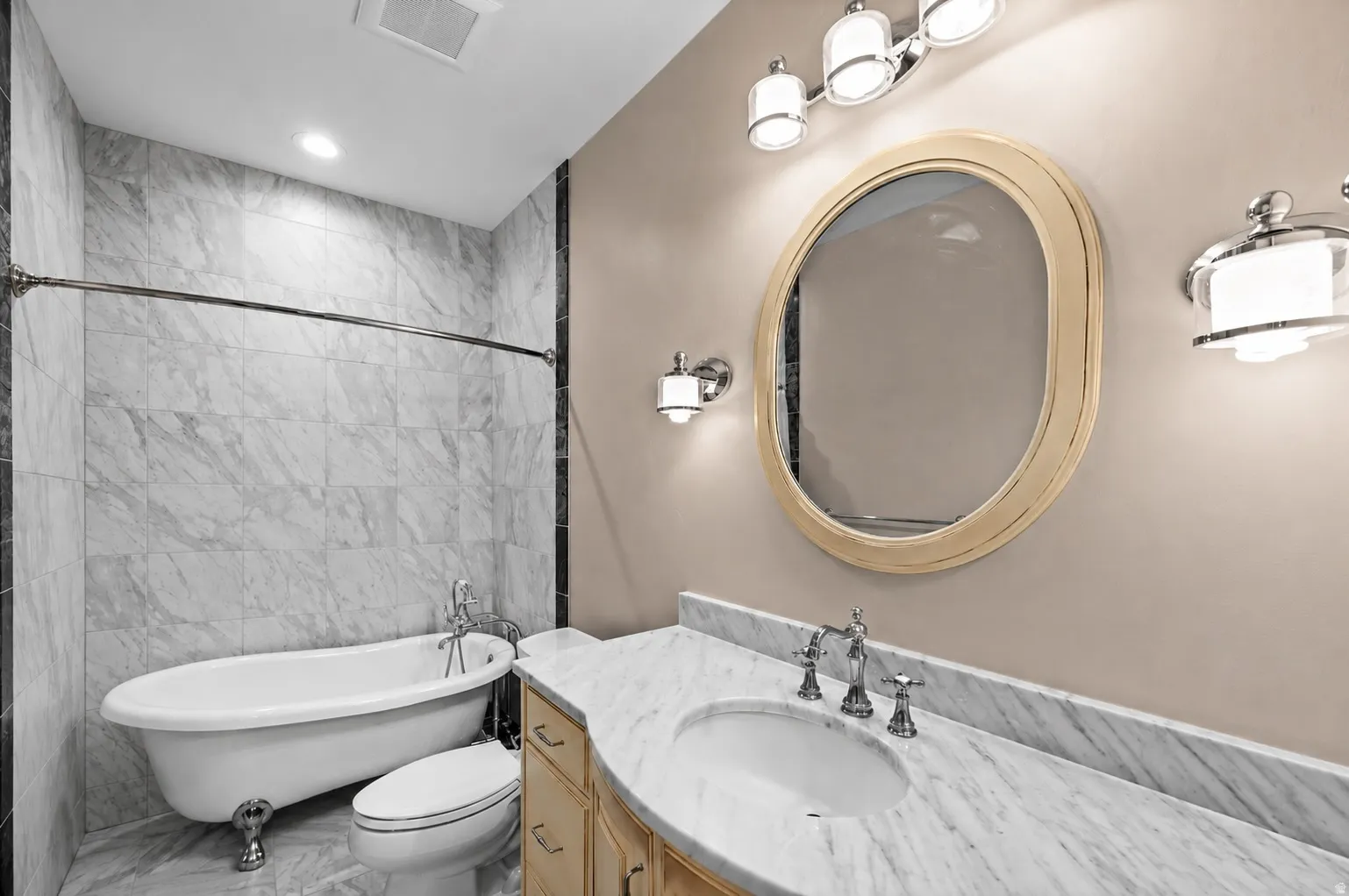 Featuring a classic clawfoot tub, this elegant bathroom offers a true spa-like retreat.