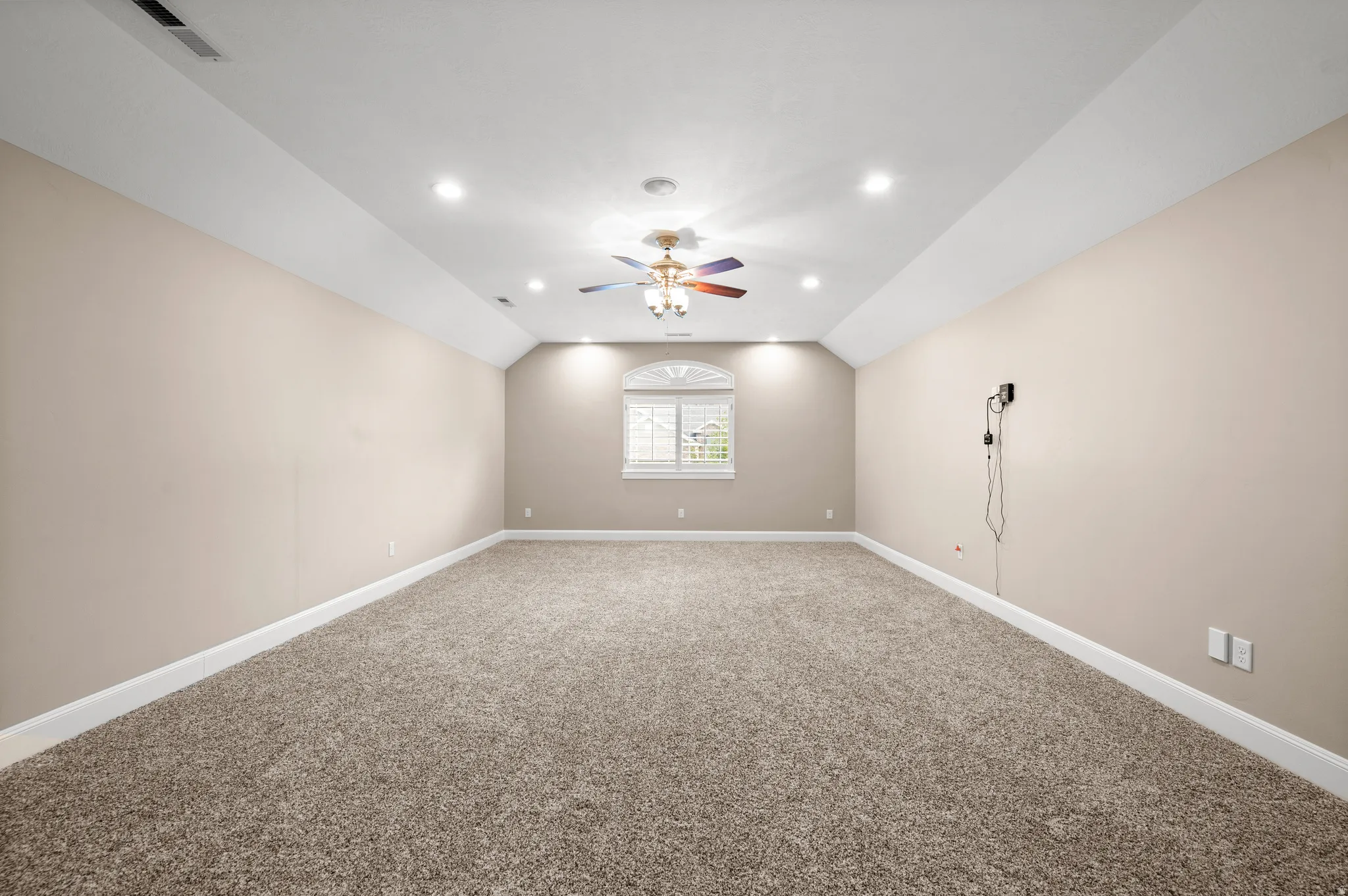 A spacious bonus room with endless possibilities for relaxing, entertaining, or creating your ideal retreat.