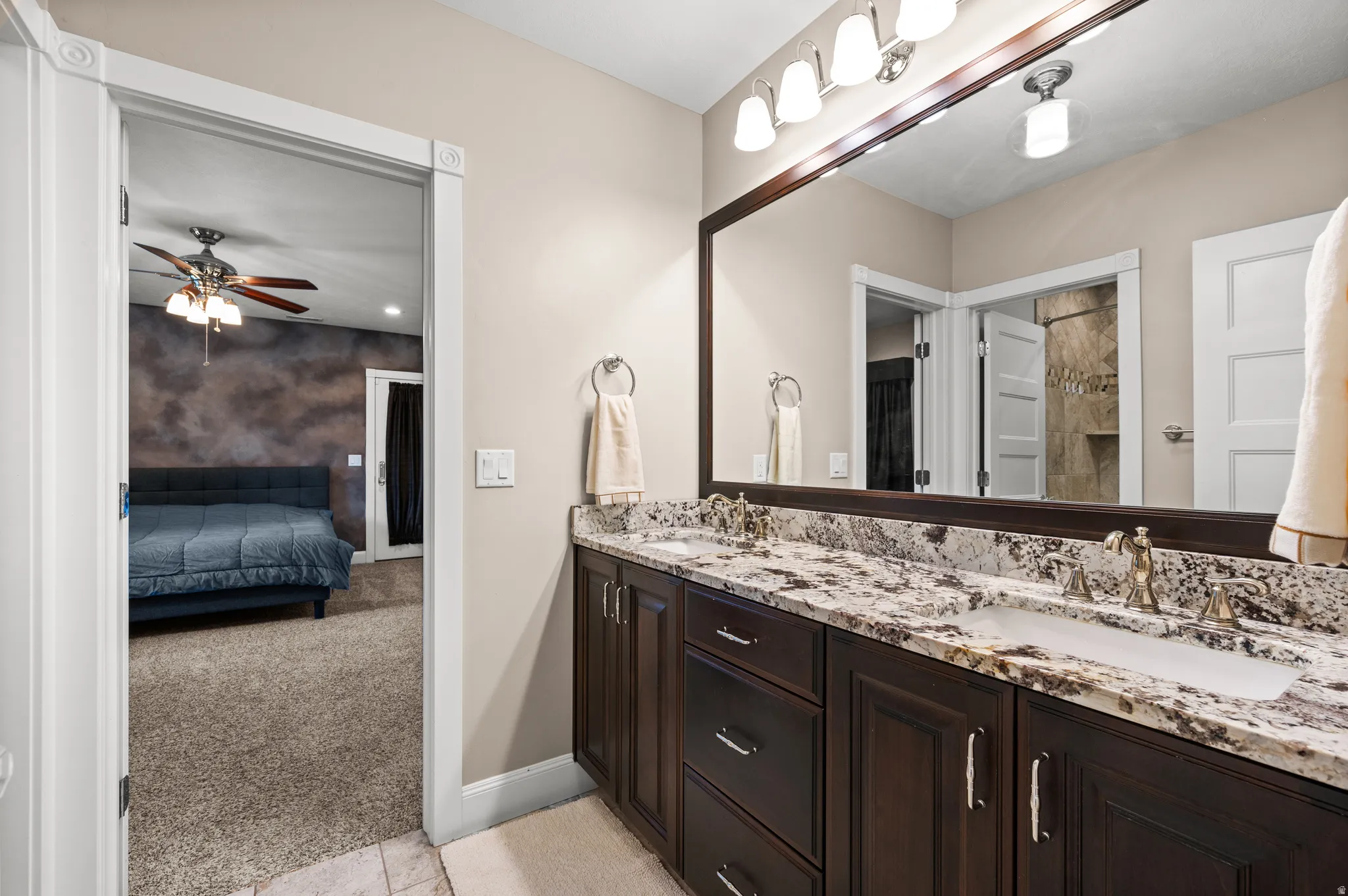 Thoughtful design continues with another private bath, enhancing the flexibility of this remarkable home.