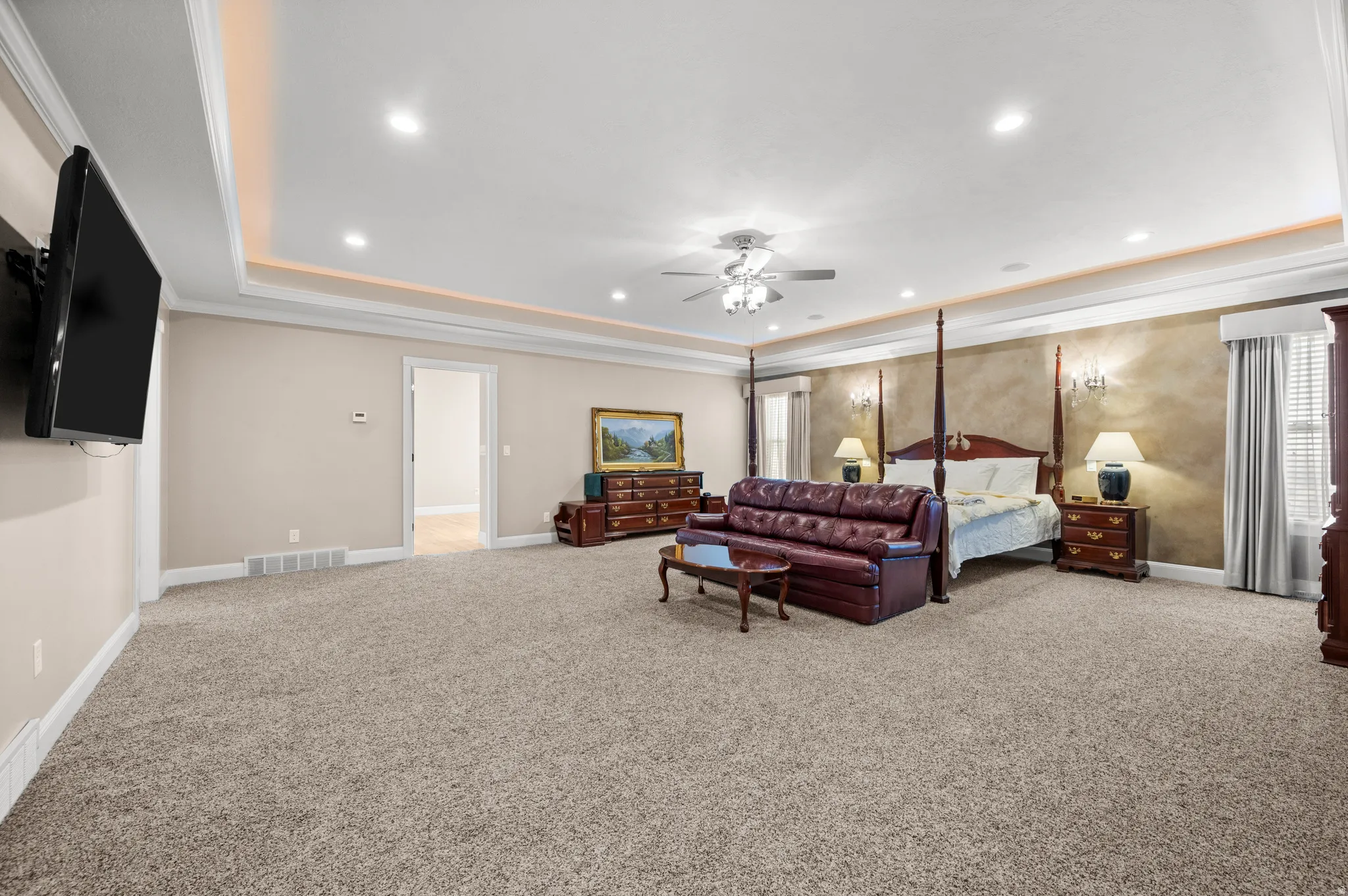 A grand primary suite that feels as inviting as it is luxurious.
