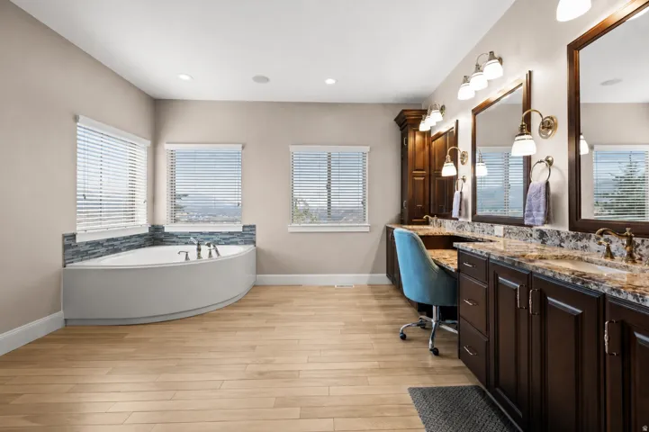 Your personal sanctuary, complete with a luxurious soaking tub, separate shower, and dedicated makeup vanity.