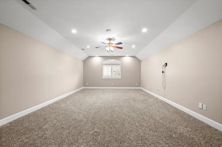 A spacious bonus room with endless possibilities for relaxing, entertaining, or creating your ideal retreat.
