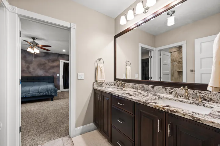 Thoughtful design continues with another private bath, enhancing the flexibility of this remarkable home.