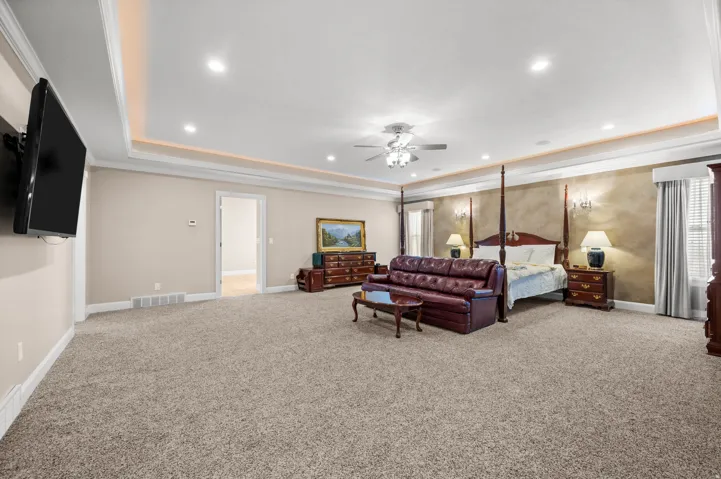 A grand primary suite that feels as inviting as it is luxurious.