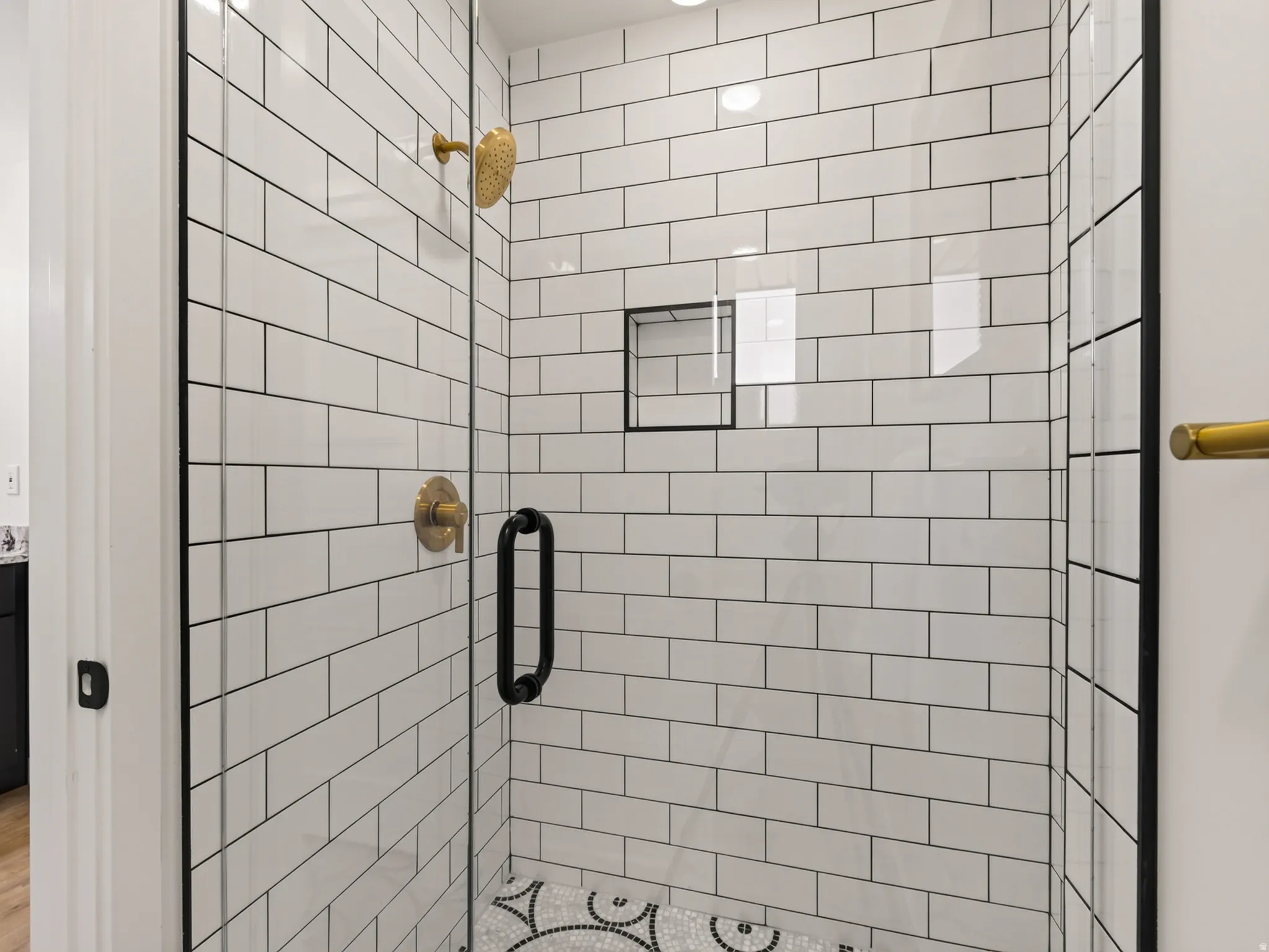 Tiled shower with new glass enclosure