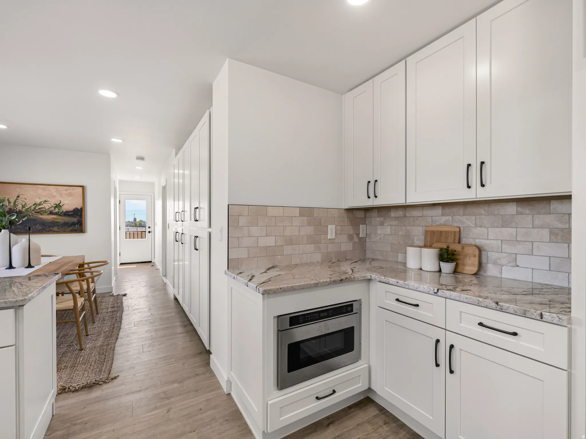 White cabinetry has dovetail joinery and soft-close drawers and doors