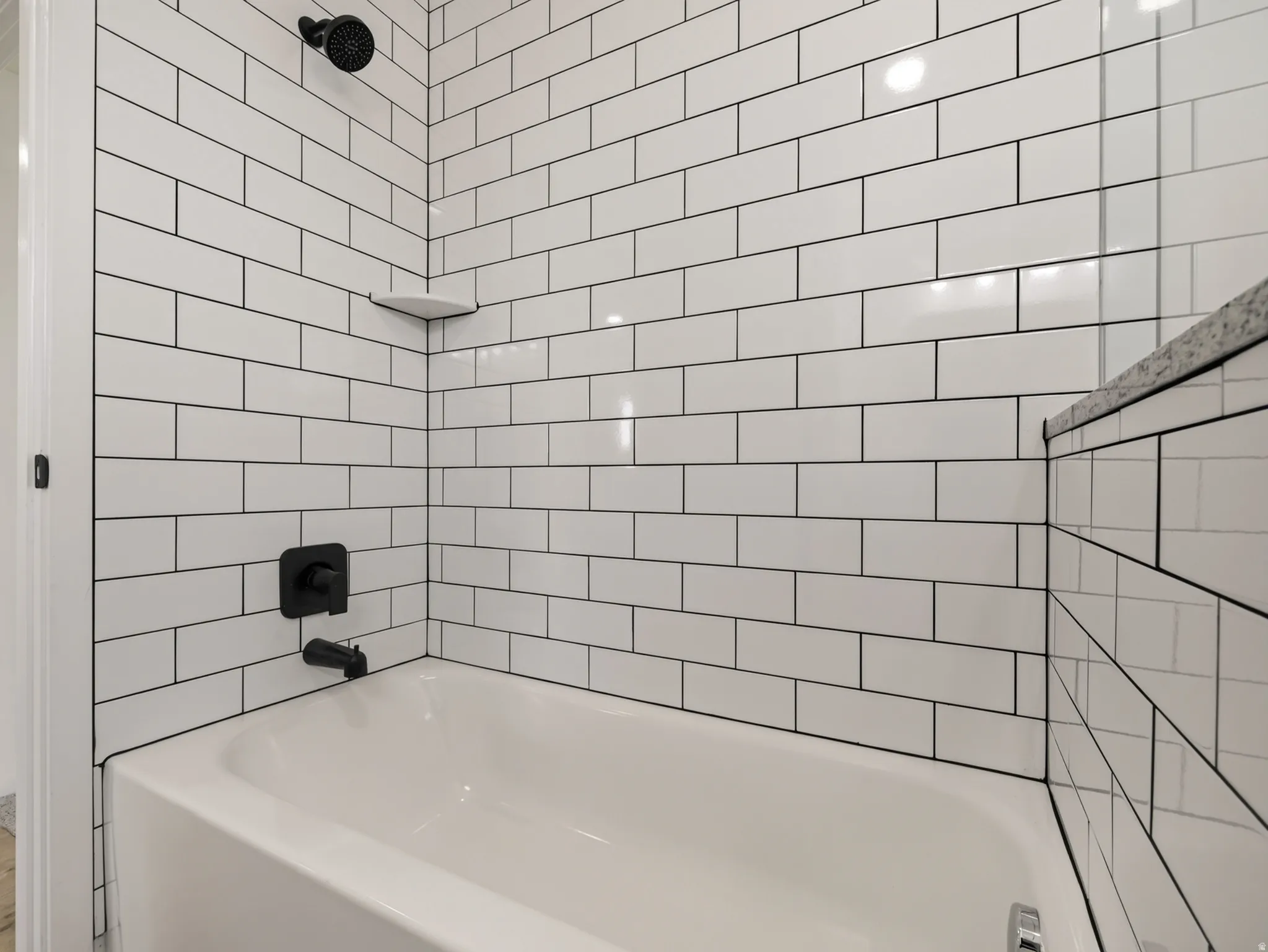 Main family bathroom has tiled tub