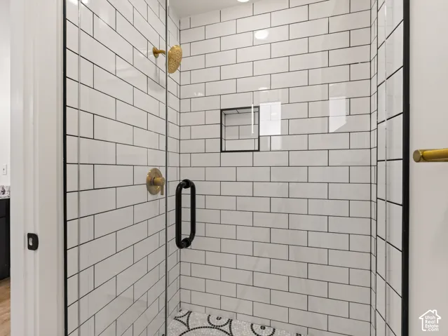 Tiled shower with new glass enclosure