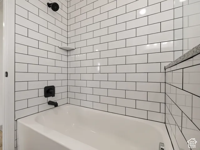 Main family bathroom has tiled tub