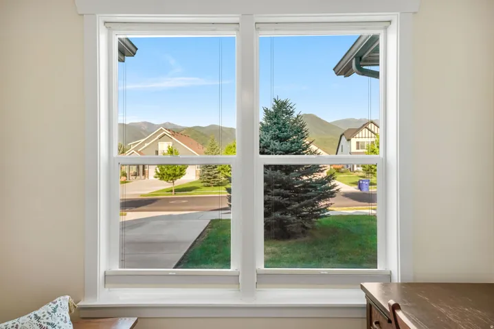 Large double-hung windows with white trim
