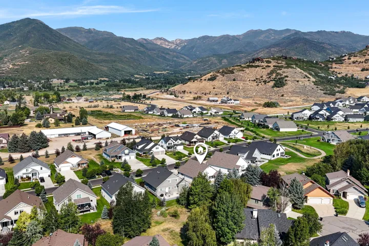 Community setting featuring residential properties and mountainous terrain