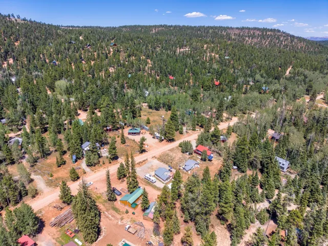 Wooded mountainous terrain with scattered residential properties