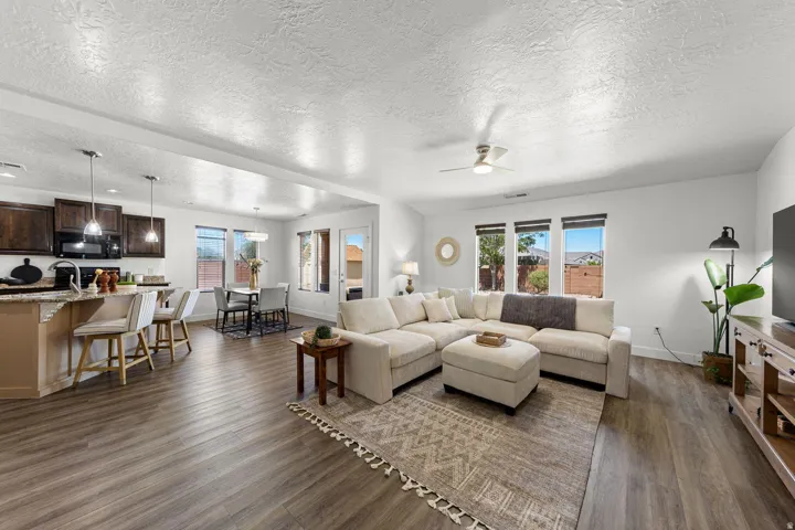 Open-concept living space featuring wood-finish flooring throughout