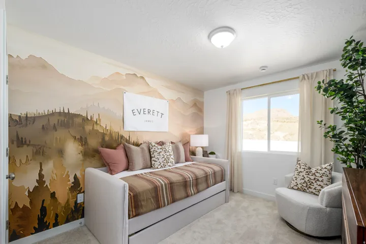 Accent wall featuring a mountain landscape mural