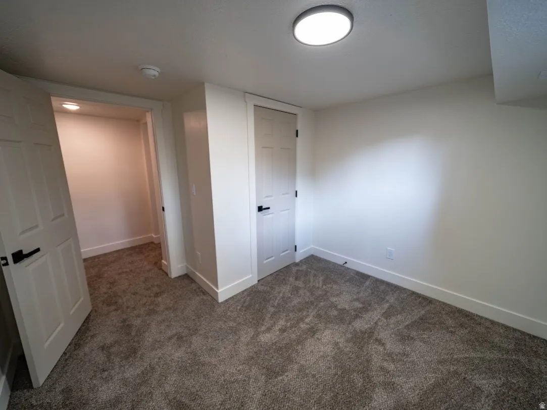 Interior room featuring neutral wall finishes and carpet flooring