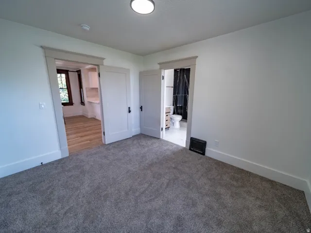 Spacious bedroom featuring neutral carpeting, recessed ceiling lighting, and multiple closet access points. third bedroom with connecting 3/4 bath.