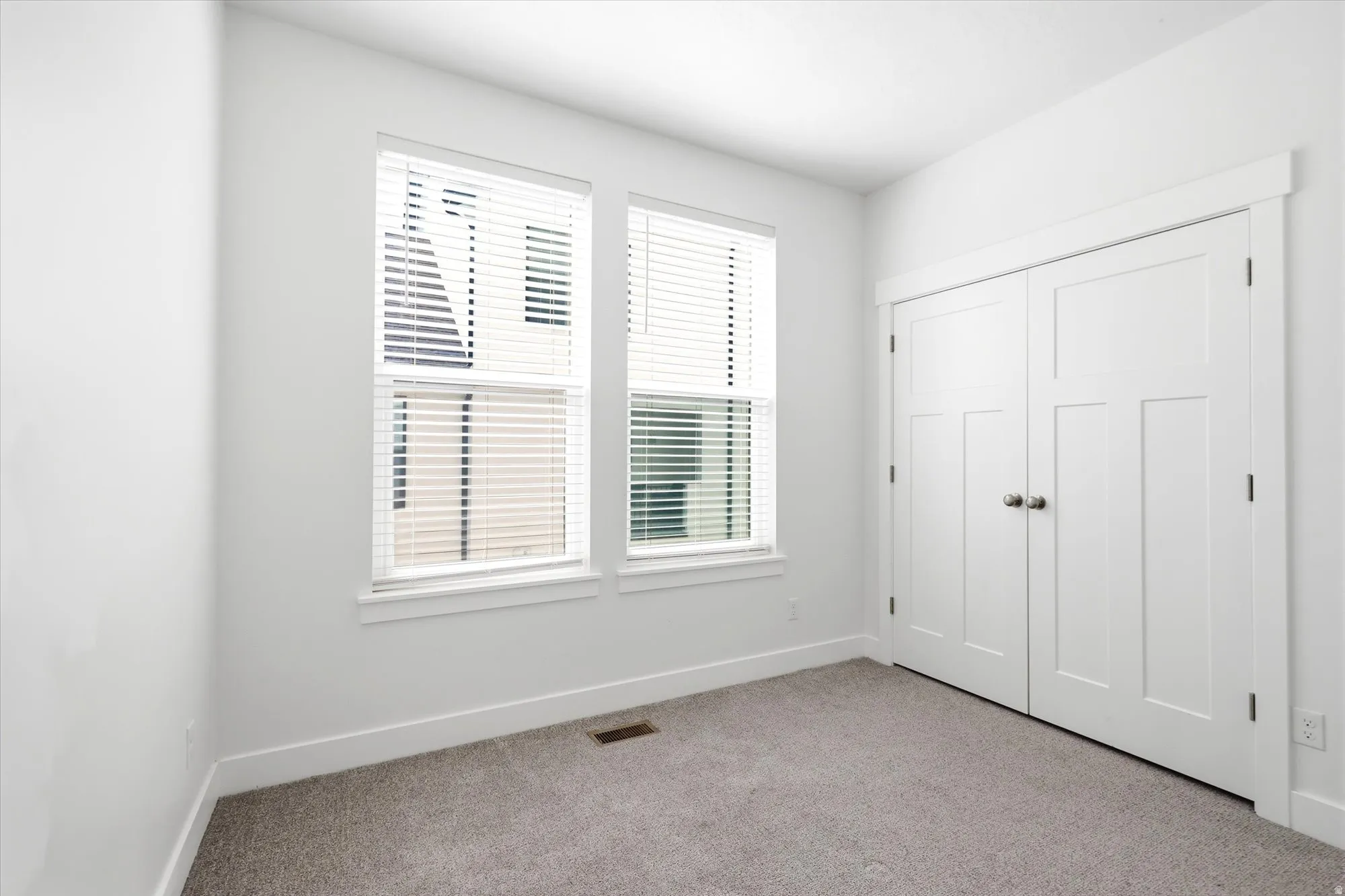 Bright interior space with light gray carpeting