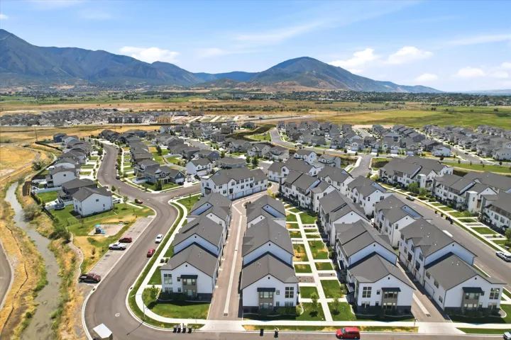 Expansive residential development featuring contemporary homes with dark-pitched roofs