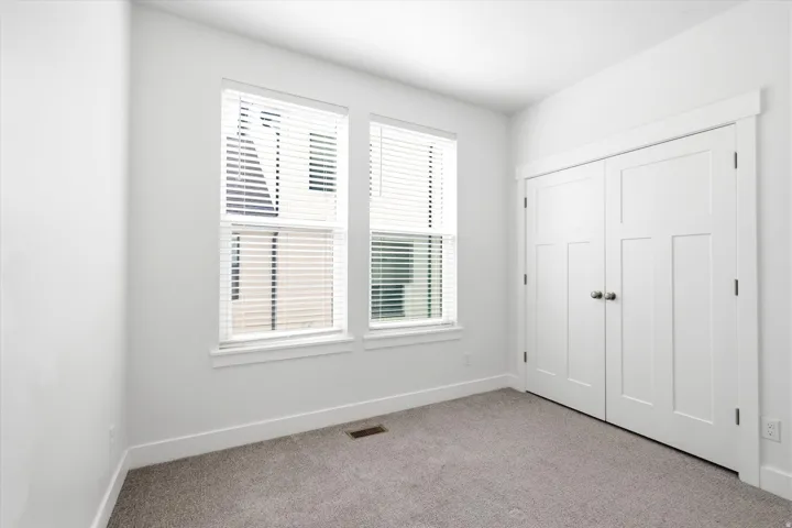 Bright interior space with light gray carpeting