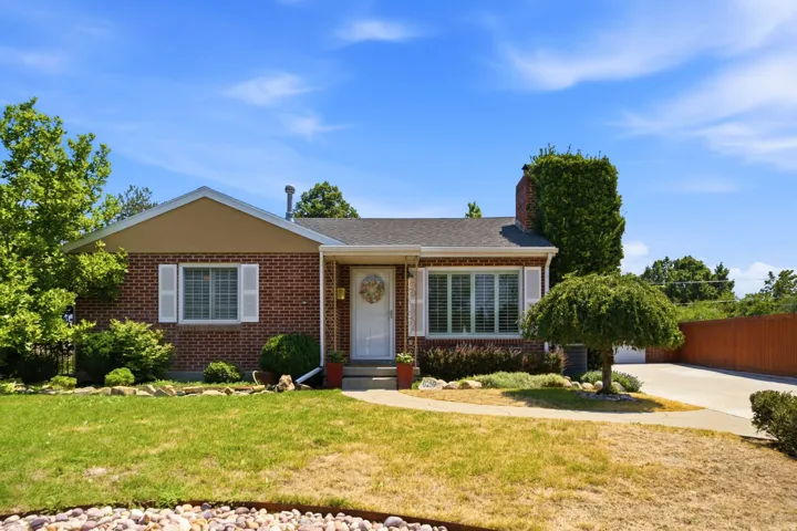Brick exterior with white shutters