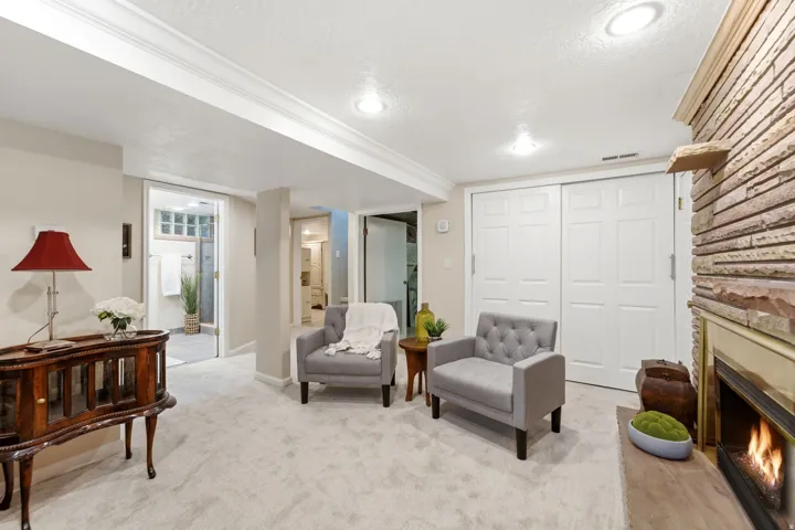 Recessed lighting illuminates the carpeted flooring