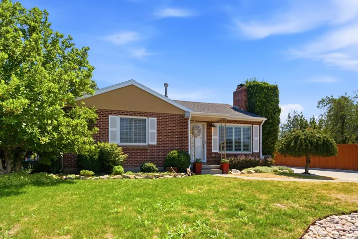Brick exterior with white shutters