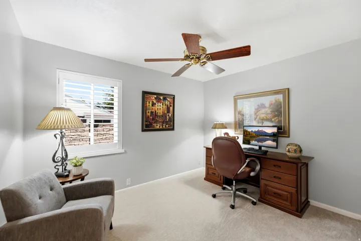 Recessed window with white plantation shutters