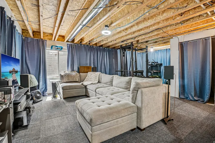 Exposed ceiling joists with visible electrical and ductwork