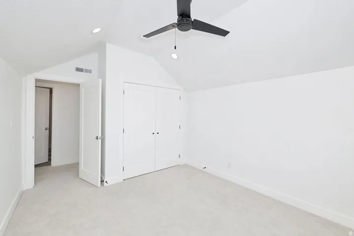 Room featuring light-toned carpeting and white walls
