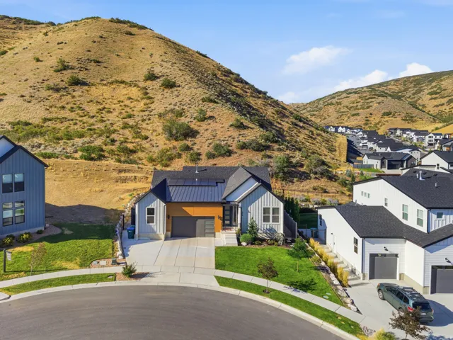 Contemporary residence featuring a blend of vertical siding and wood-finish accents