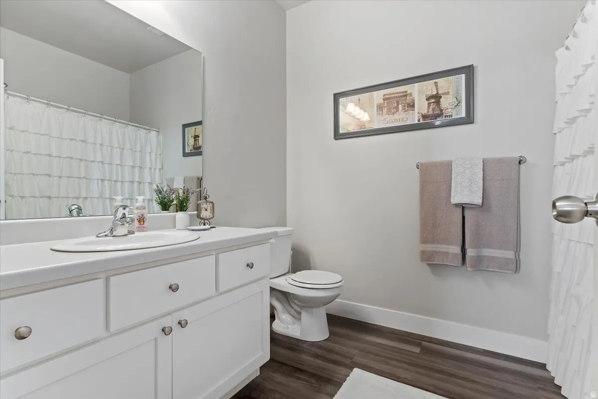 2ND BATHROOM - featuring a white vanity with integrated sink, chrome faucet, and matching white cabinetry