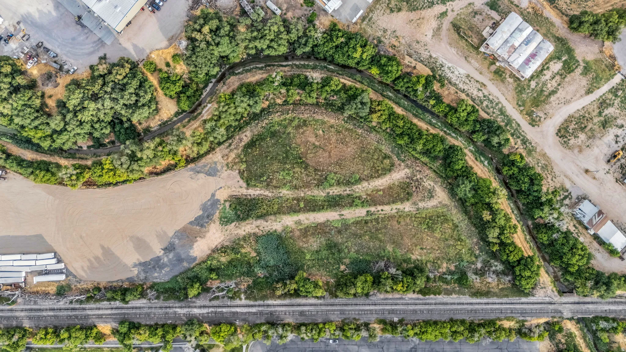 Expansive aerial overview showcasing a sizable land parcel with diverse ground cover