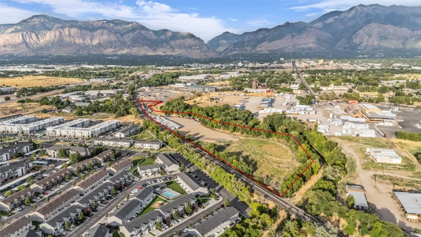 Expansive parcel featuring a mountain backdrop and surrounding developed areas