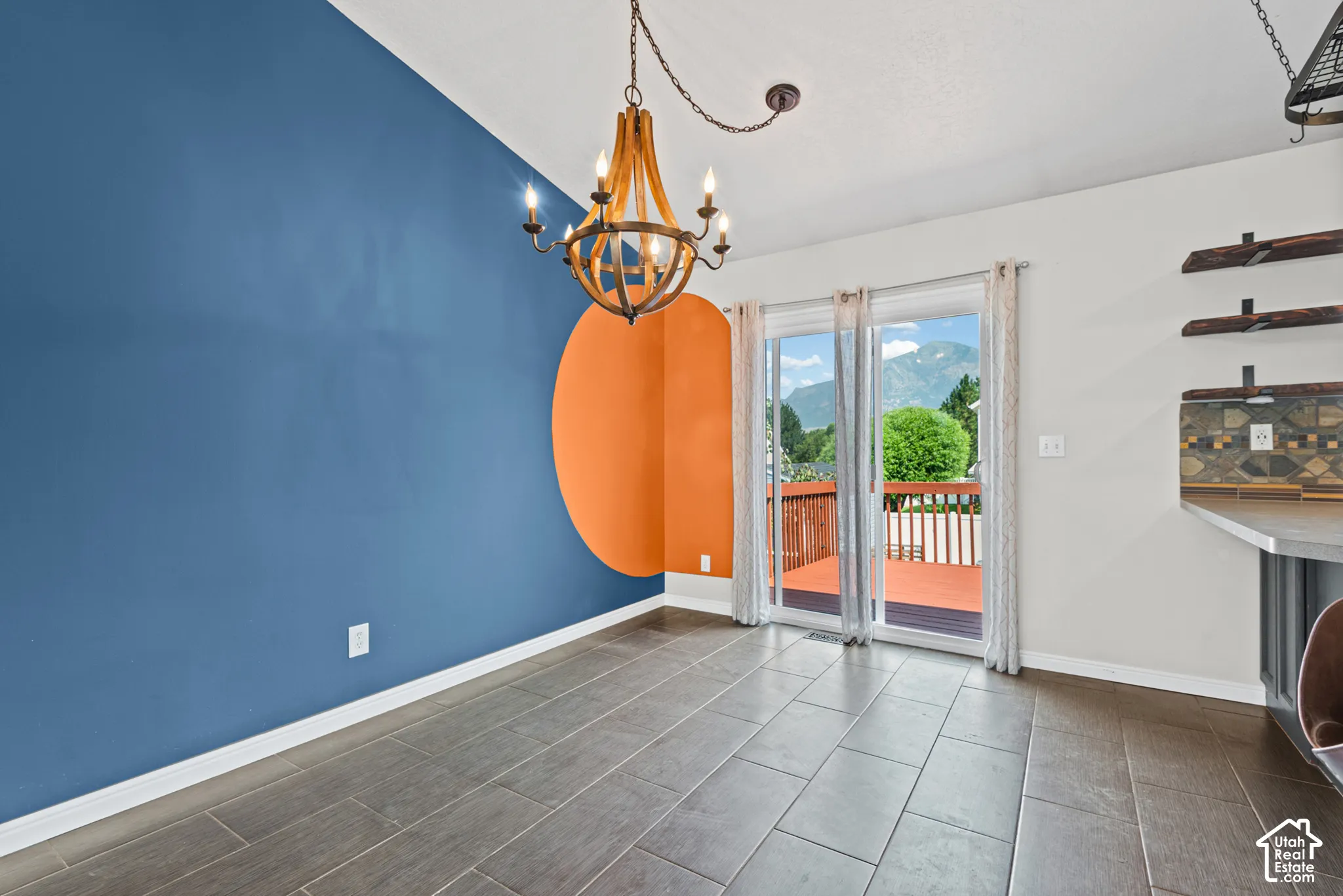 Wood-look tile flooring complementing a decorative accent wall