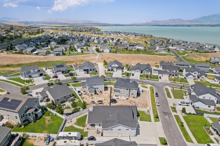 Aerial perspective showcasing a residential community with paved streets and established homes