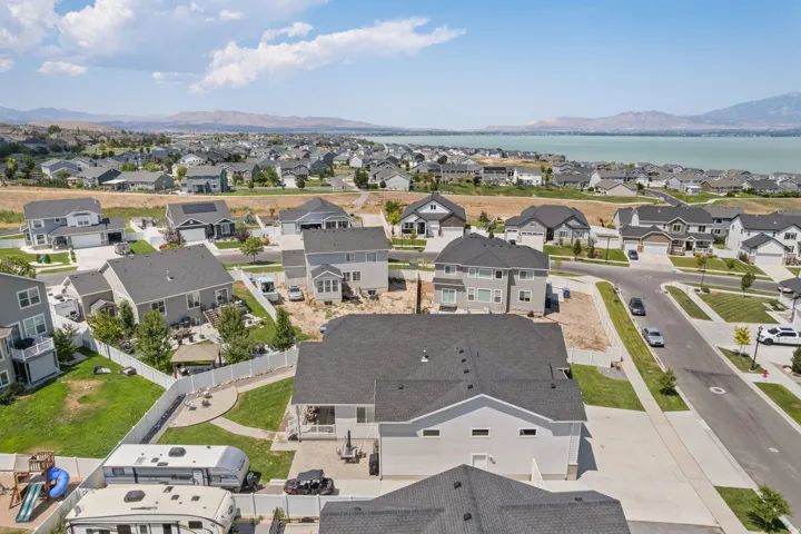 Overhead perspective of a residential area showcasing a neighborhood of homes with varied architectural styles