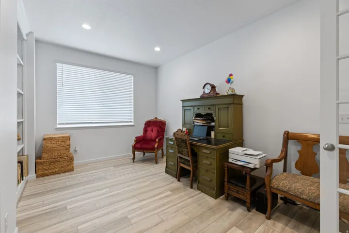 Light wood-finish flooring with recessed lighting
