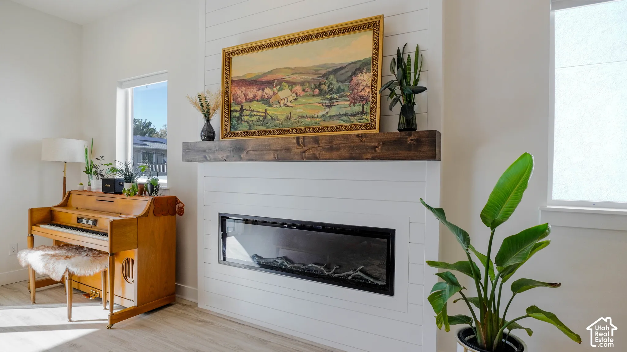 Feature wall with horizontal shiplap detailing and a linear electric fireplace