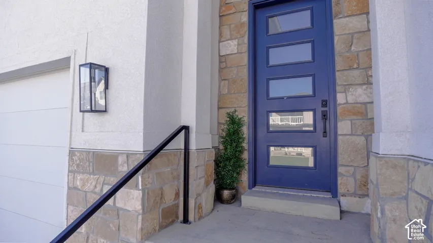 Stone veneer exterior with stucco accents