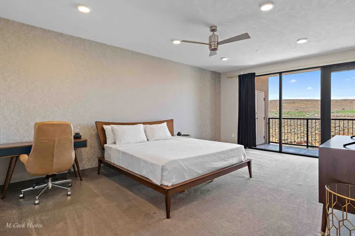 Spacious room featuring carpeted flooring and textured wall accents