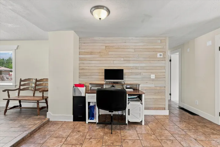 Distinctive wood-panel accent wall and durable tile flooring