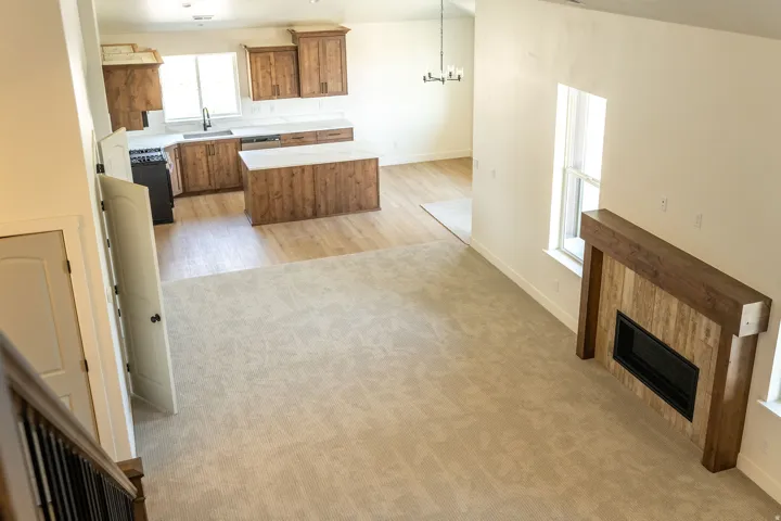 Kitchen featuring wood-finish cabinetry, white countertops, and a central island